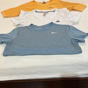 Three Athletic Shirts. Stella McCartney Size L, Adidas Size M, Nike Size M